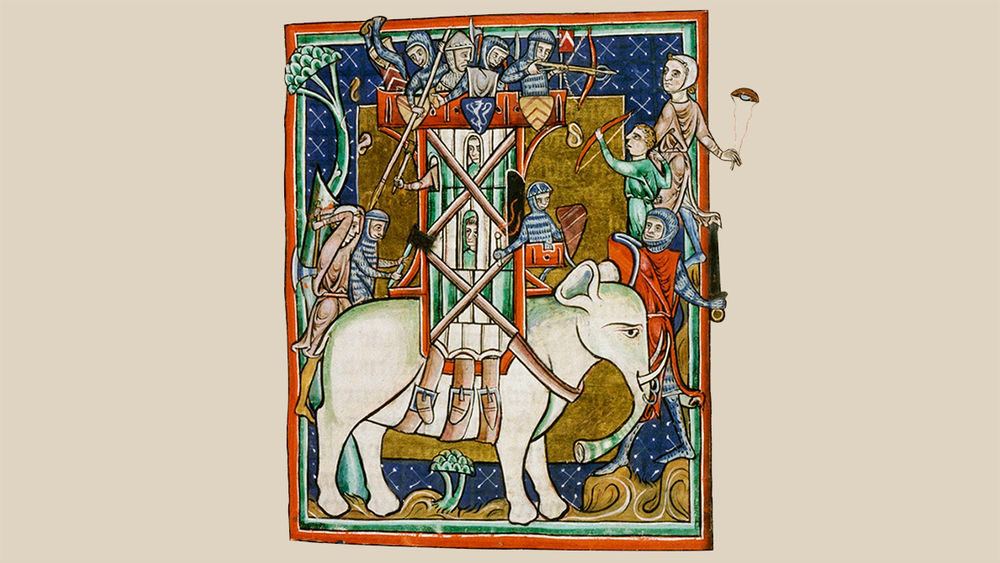 In an illustration, a tower with armed men on its roof is strapped to the back of a white animal with trunk and tusks.